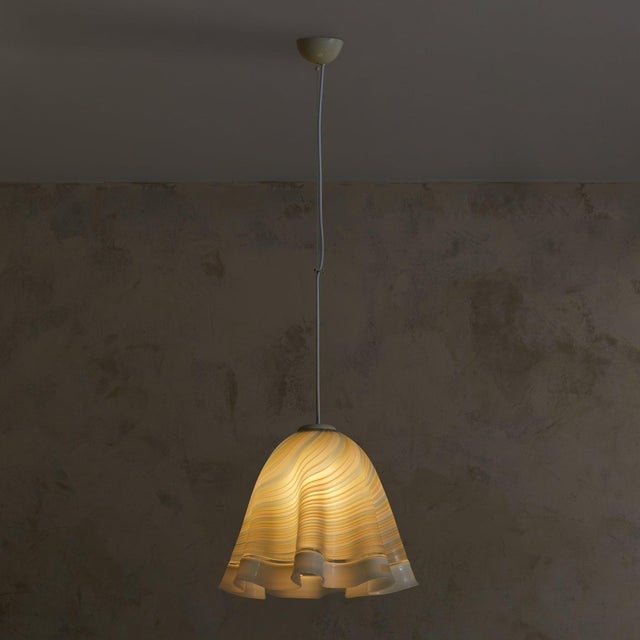 This Murano glass pendant is an elegant reflection of 1970s Italian artistry, showcasing fluid lines and masterful...