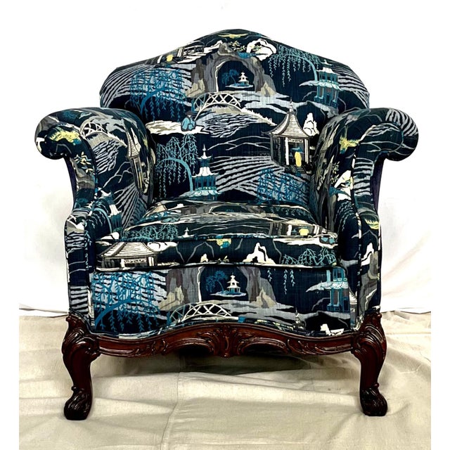 This classic 1920s club chair features rolled arms and a Bergere-shaped crest with beautifully carved mahogany woodwork...