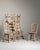 A distinguished set of six French oak dining chairs, dating to circa 1970, reflects the enduring elegance of mid-century...