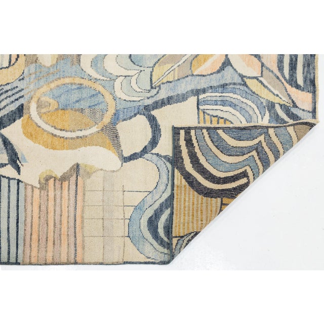 Transform your space with this stunning 5x9 Modern Art Deco rug, featuring a stylized female profile in slate blue, golden...