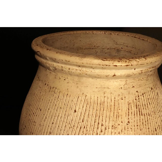 American Pottery Pair of Terracotta Vases Late 20th Century A striking pair of large terracotta vases, each with a robust...