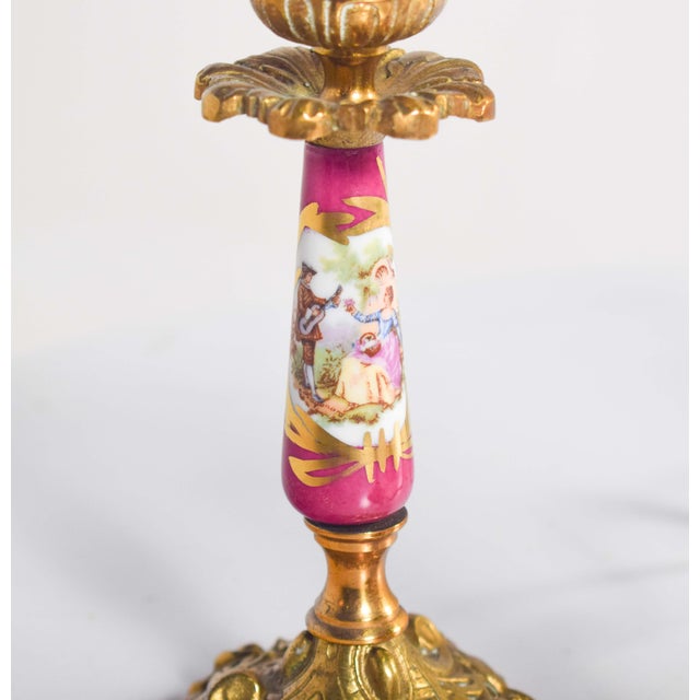 Lamp and two chandeliers in pottery and metal in the shape of candlesticks, where the base and candlestick are made of...