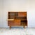 A teak highboard by Jentique with a fitted drinks section. Teak veneer construction with dovetailed drawer boxes, recessed...