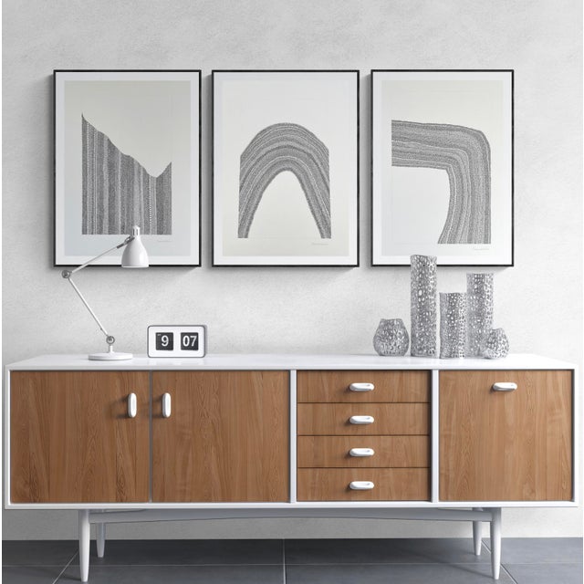 This piece features an abstract configuration on paper of tiny circles drawn with black ink enclosed in pencil frame....