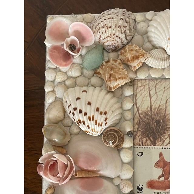 Custom made sea shells encrusted photo frame with stamps block with squirrels.