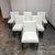 Design Plus Gallery presents a Set of Six Milo Baughman Style Cantilever Dining Chairs. Each chair pairs white vinyl...