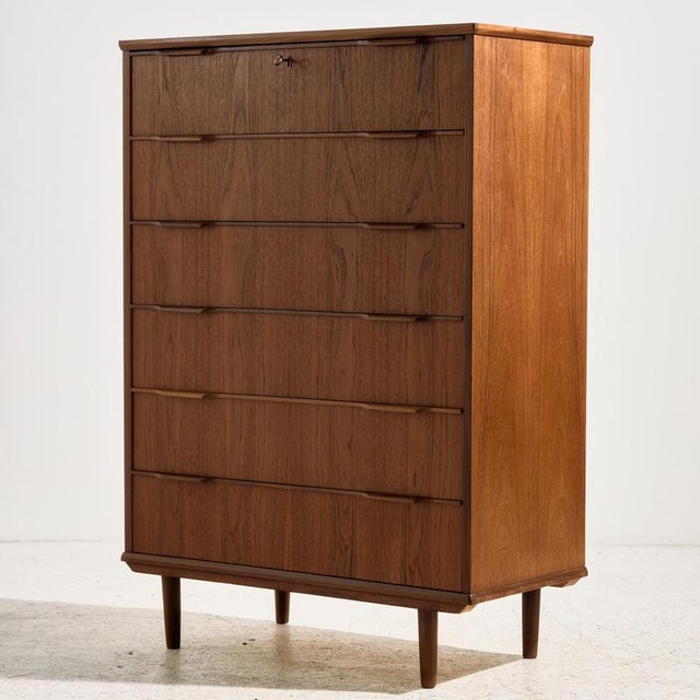 Restored Danish teak dresser with six drawers and unique handles from the 1960s. Exciting shades of teak, clean details...