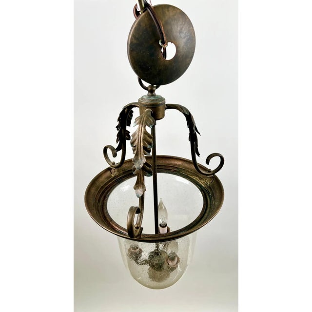 French Regency Style Bell Jar Pendant with Seeded Glass and Acanthus Leaf Bronze This elegant French Regency style bell...