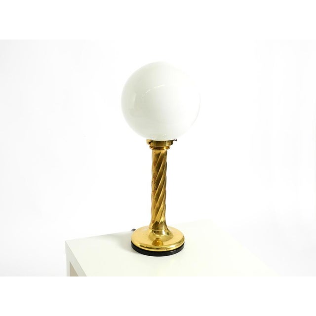 Stunning 1960s brass table lamp with a column shaped base and a frosted glass lampshade. Minimalist mid-century design...