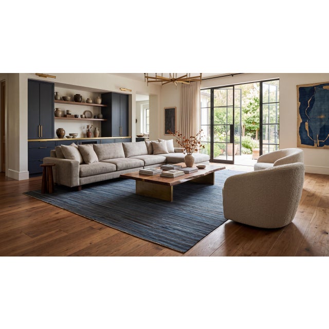 Elevate your space with this understated, contemporary hand-woven Kilim wool rug, expertly crafted with a sophisticated...