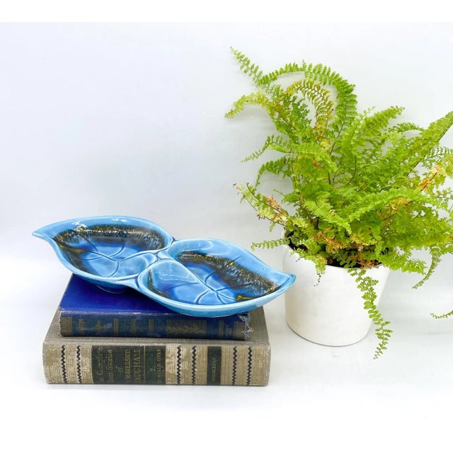 Gorgeous, mid-century modern dish with a double leaf pattern and drip glaze. Maker's mark stamped on the underside....