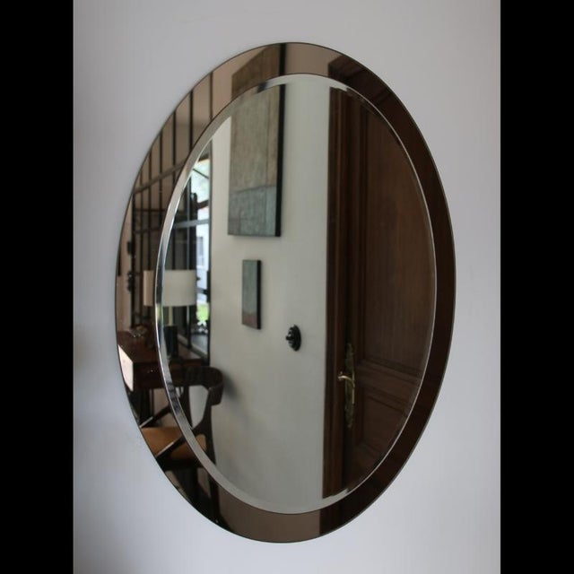 Large wall mirror dating from the 1960s–1970s, designed in the style of Antonio Lupi. This model perfectly illustrates the...