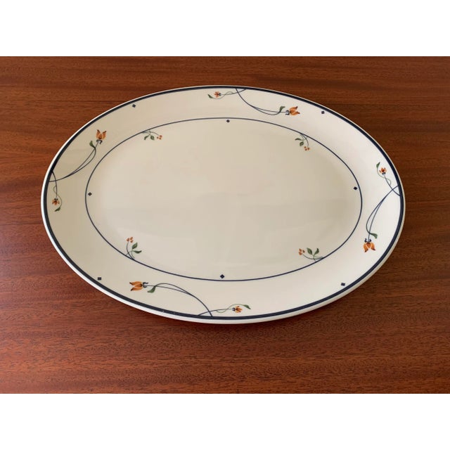 Beautiful elegant bone china oval serving tray decorated with lovely tiny orange and burnt umber flowers with curved stems...