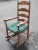 A large, Early American Walnut Ladder Back Rocking Chair with Double Sided Split Reed Seat. Come with a hunter green...