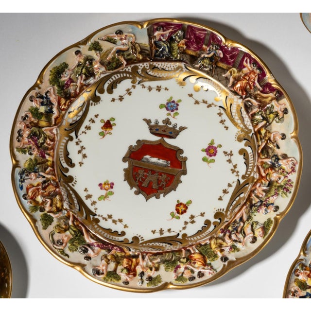 Set of 8 Antique Capodimonte Armorial Crest Cabinet Plates. Each with blue-painted crowned "N" mark; comprising seven...