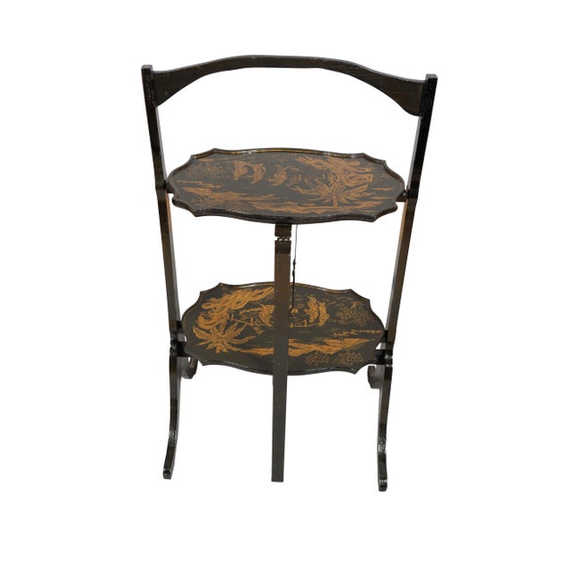 Can fold and be used as a decorative screen. Two shelves with Chinoiserie decoration.