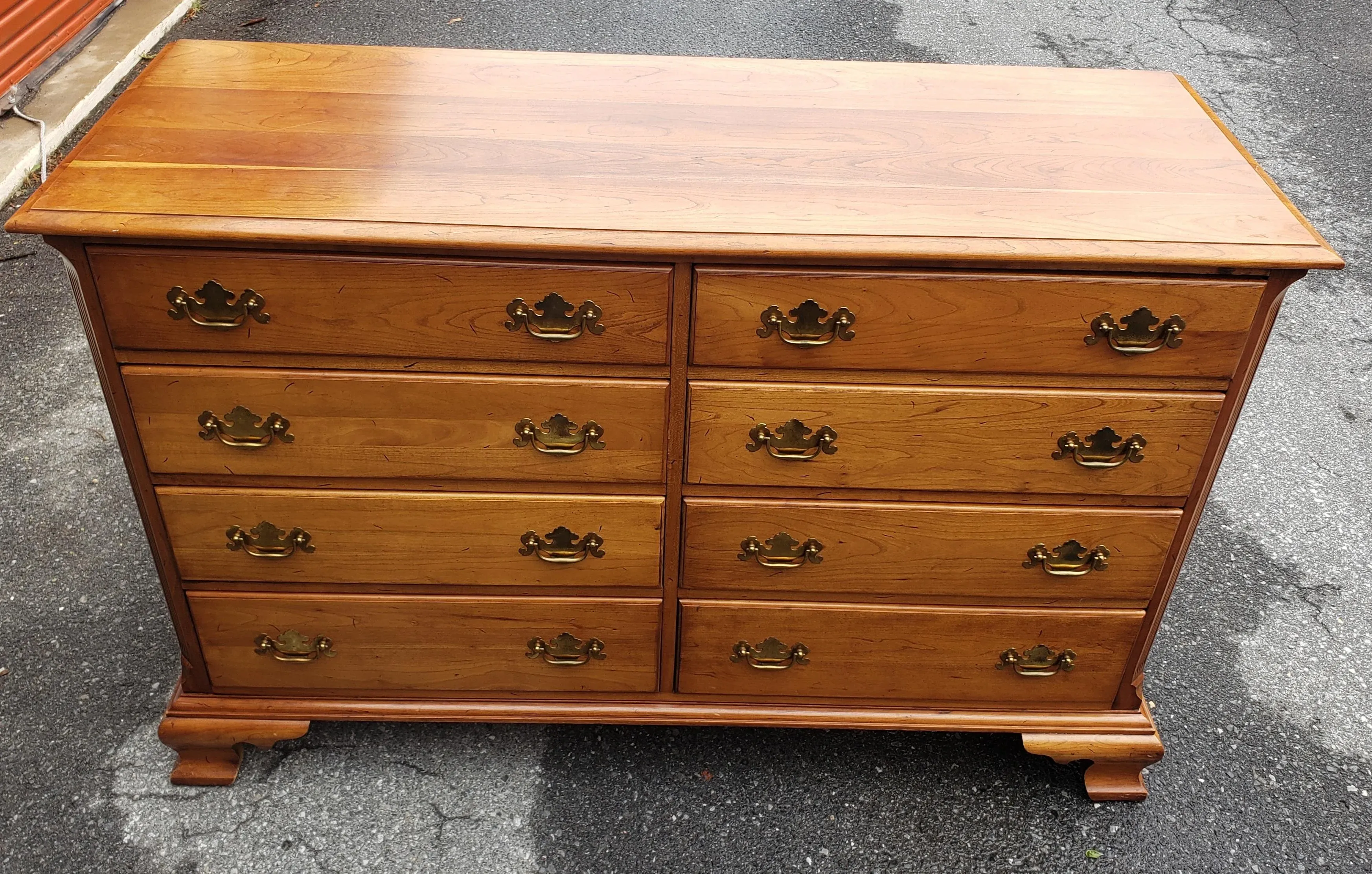 A Mid-Century Refinished Chippendale 8-Drawer Light Wild Cherry