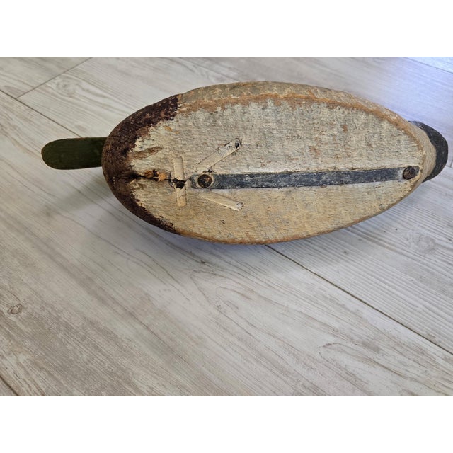 An exceptional, authentic early-to-mid 20th-century working black duck hunting decoy, presented in beautiful "as-found"...