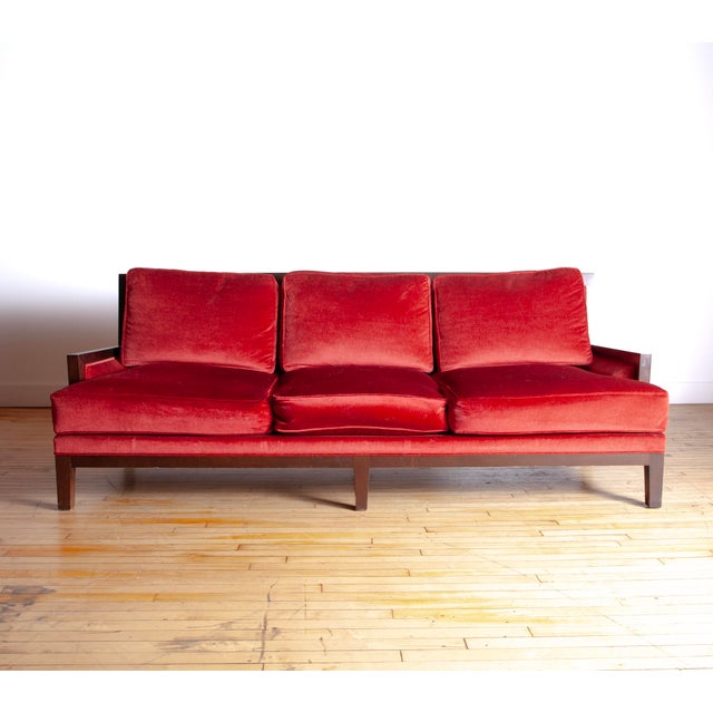 Beautiful Christian Liaigre sofa in fantastic soft red velvet-like fabric. Dark brown espresso oak wood frame. Unmarked....