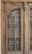 Antique, 1920's Art Deco carved wood and wrought iron entry doors in the original frame. Doors feature a distinctive Art...