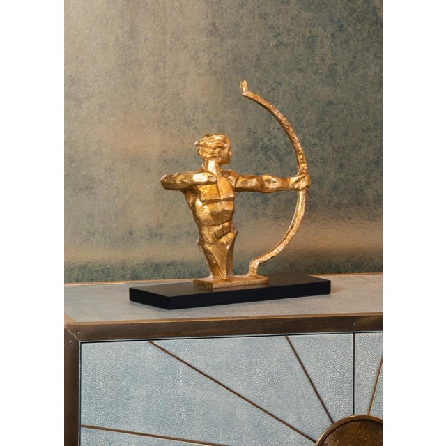 Cast composite in gold leaf on black mounting 14h x 13w x 6d