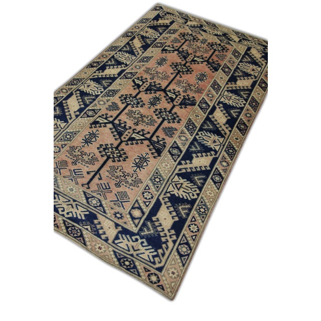 Introducing a one-of-a-kind vintage Turkish handmade wool rug, a masterpiece crafted by skilled artisans using traditional...