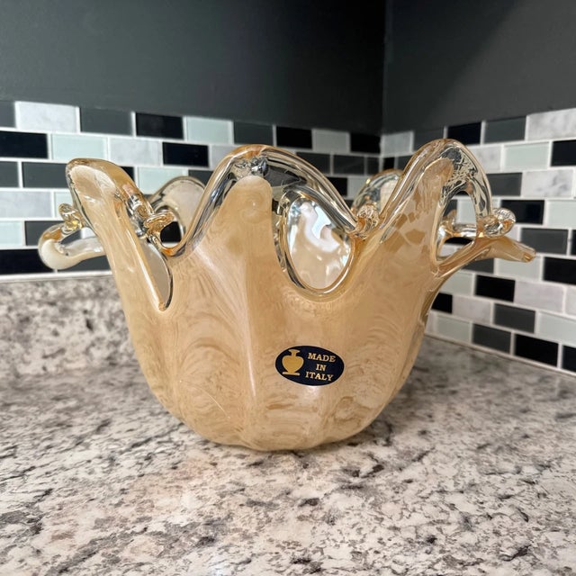 Stunning authentic Murano art glass bowl or vase featuring an elegant white cristal finish with a flowing champagne-...