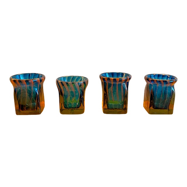 Striking and sculptural, this set of four handblown glass candle holders is the work of Robert C. Fritz (1920–1986), a...