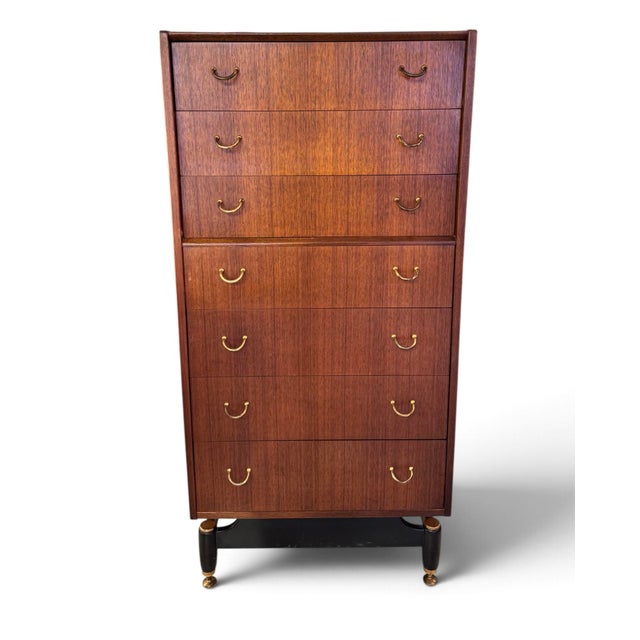 Designed by Victor Wilkins in 1966, this G Plan Tola mahogany tallboy features clean lines, elegant proportions and the...