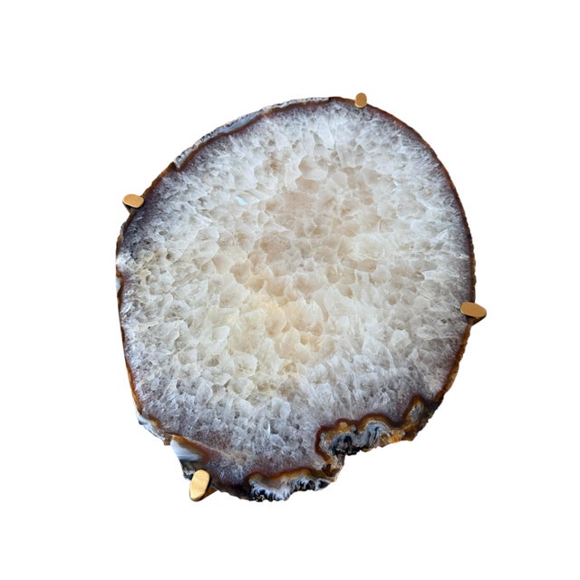 Unusual Modern Handcrafted Drinks Table. Oval textured Geode Top with Brownish edge on a gilded steel base.