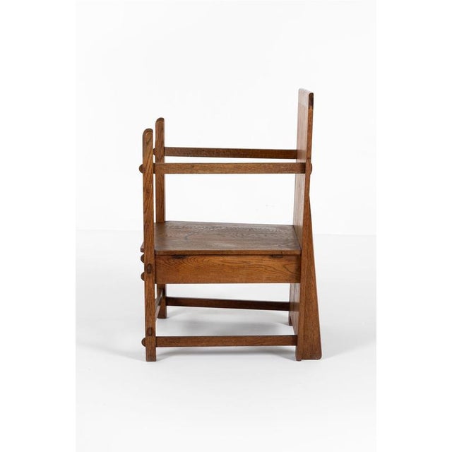 An oak traditionalist chair from the amsterdam school of designers and architects. This beautifully unique armchair...