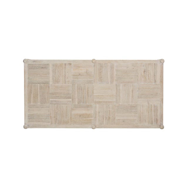 Its two-tier structure showcases a striking patchwork top of acacia wood, meticulously crafted in a parquetry board...