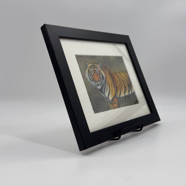 Vintage original tiger painting on woven fabric, featuring a tiger standing among tall grasses in warm shades of ochre,...