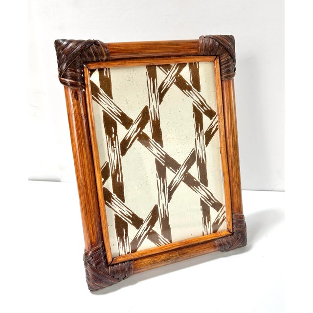 Natural warmth meets organic craftsmanship in this handsome bamboo and rattan frame. The woven corners and honeyed tone...