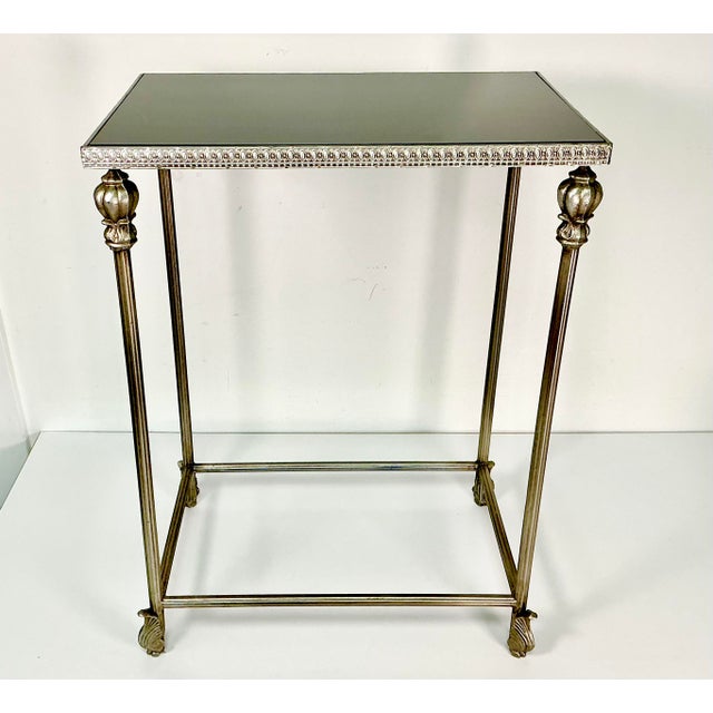 We fell in love with this little side table. It has traditional Neoclassical style from its metal column legs with...