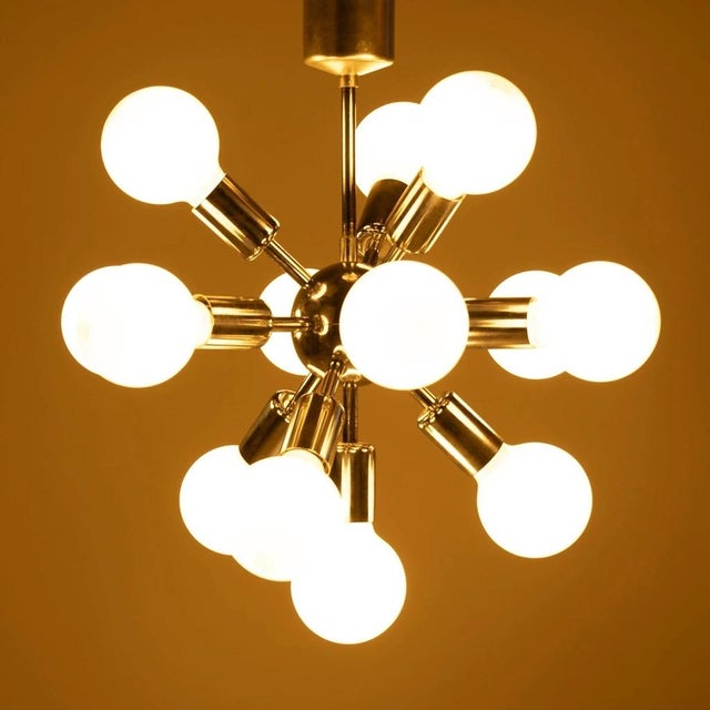 Futuristic metal chandelier type 21418 nicknamed "sputnik", produced by the czechoslovak company drupol in the 1970s....