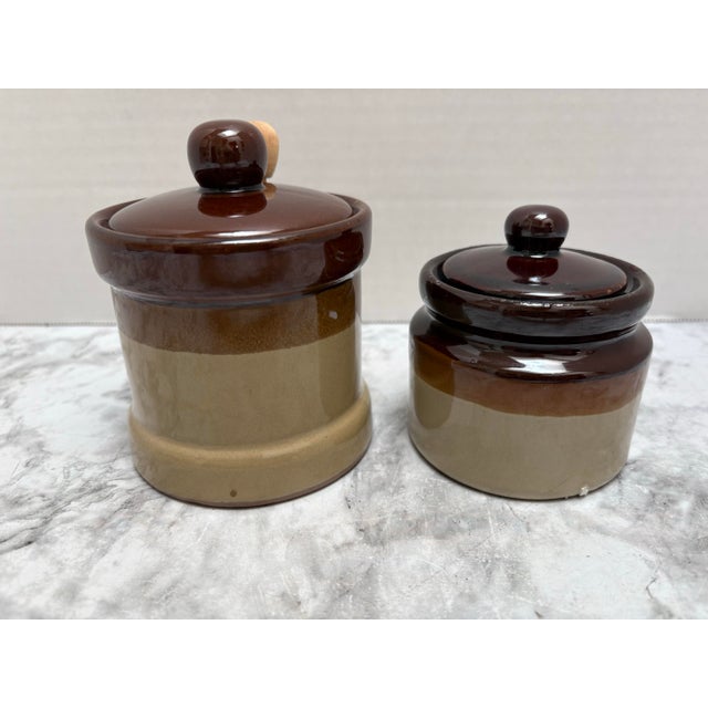 Vintage Midcentury Americana pottery ceramic rustic earthy honey pot and sugar vessel. Both have lids. The honey pot is so...