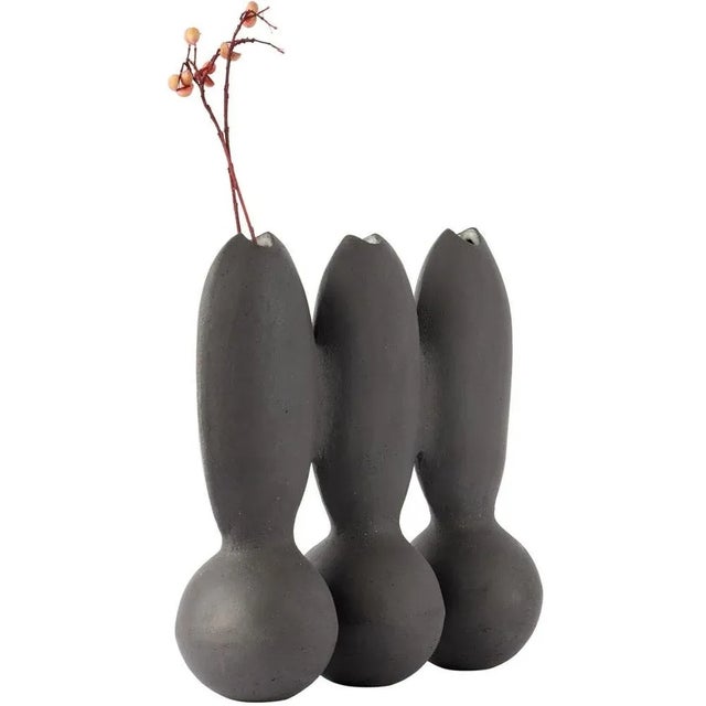Itera black triple vase by ia kutateladze one of a kind. Dimensions: d 10 x w 30 x h 27 cm. Materials: raw black clay....