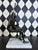 A signed limited edition bronze sculpture by Gustavo Gutierrez depicting a seated harlequin musician holding a lute. The...