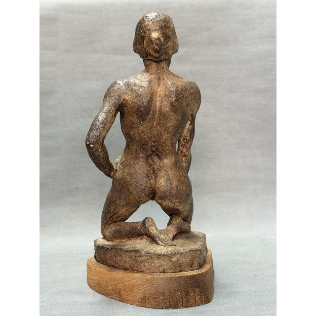 Female nude. Handmade terracotta sculpture. No apparent signature, attached to a wooden base. Overall dimensions: 26 x 13...