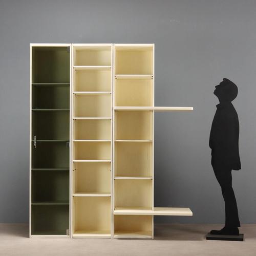 Modular unit, also usable as a freestanding unit, consisting of one display cabinet with a hinged glass door and two open...