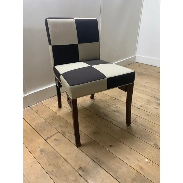 This is the Lachine Chair Attributed to Brueton. It has brown and cream checkered upholstery with dark brown legs.