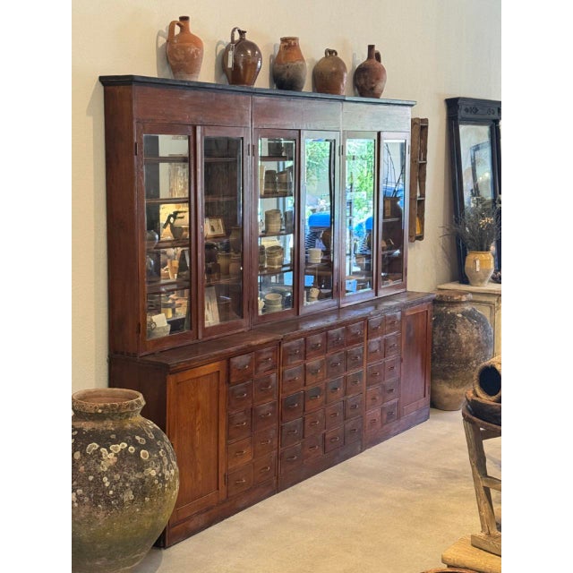 A truly monumental Hungarian apothecary cabinet dating to circa 1900, remarkable for both its extraordinary scale and...