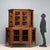 Double-bodied walnut sideboard, notched. The door panels on the base and top have been replaced with glass, with brass-...