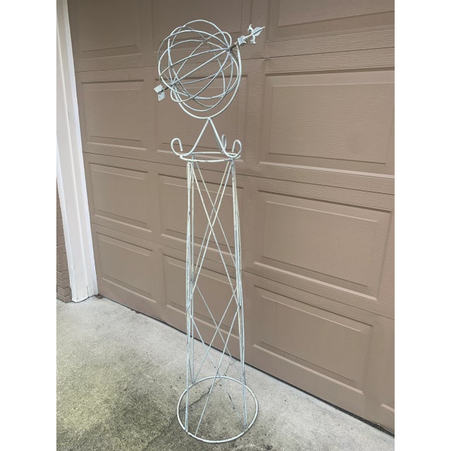 A beautifully crafted iron armillary sphere on stand, evoking the timeless elegance of classical European gardens. Pieces...