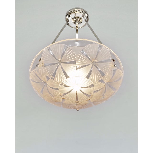 Francis Hubens & Degué A nickel-plated bronze or solid brass French art deco pendant by Francis Hubens made around...