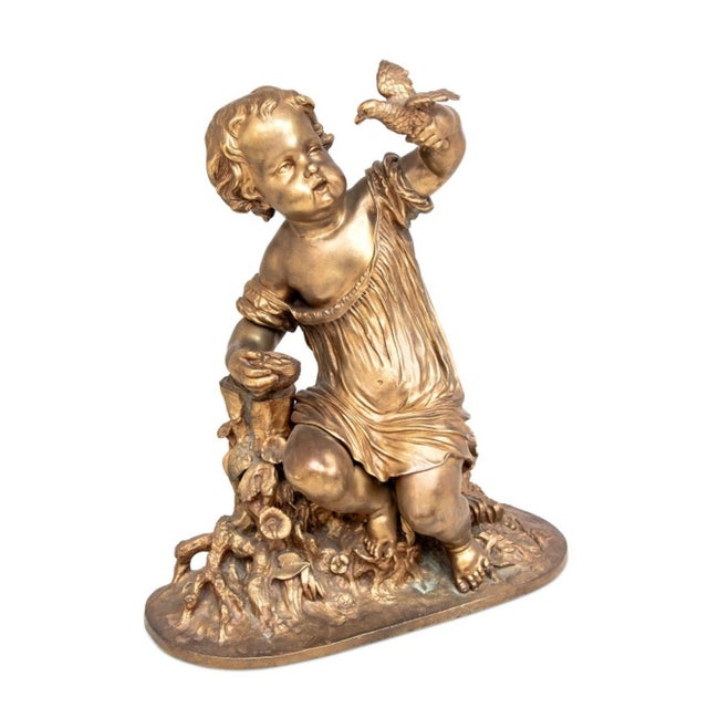 Auguste Moreau (French, 1834-1917) "The Egg Thief" Gilt Bronze Sculpture, late 19th century, the seated cherub upholding a...