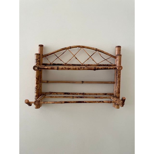 Vintage Scorched Bamboo Wall Shelf with Towel Rod This vintage scorched bamboo wall shelf brings a warm, tropical feel to...