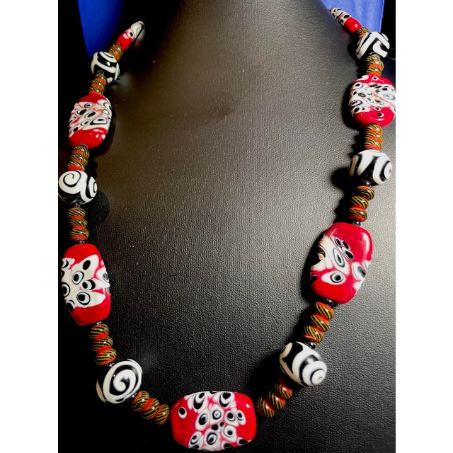 This Venetian millefiori necklace features handcrafted glass beads, 26 inches long, with sterling silver toggle clasp. The...