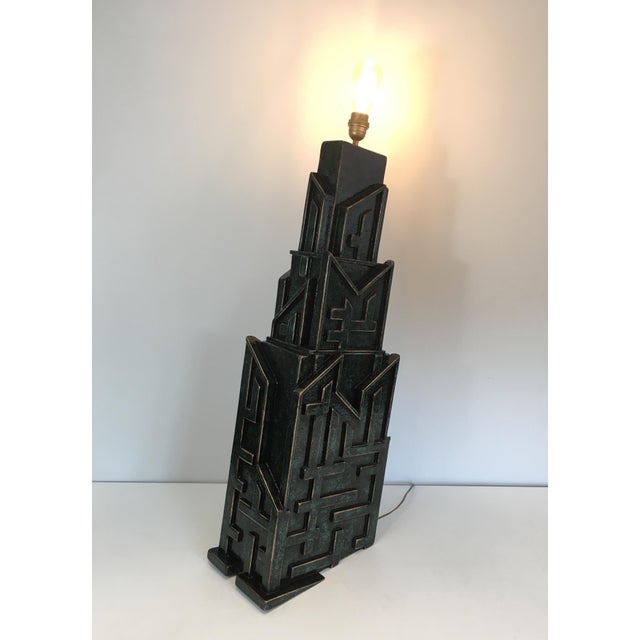 This unique, important and highly decorative brutalist lamp is made of carved and patinated wood. This is a very beautiful...